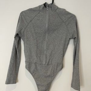 Super cute front zip grey thong bodysuit